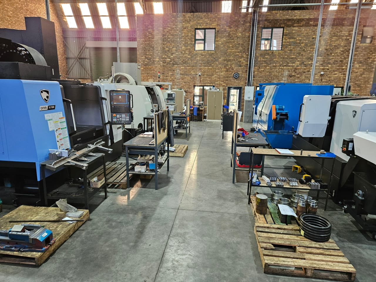 Four CNC machines on the Faltec production floor